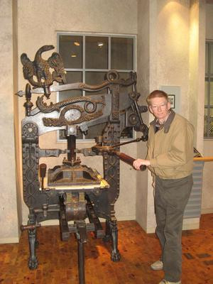 A very early manual printing press.