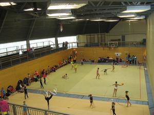The event was held in a large gymnasium.  The main floor was divided in half by a movable wall.  This is the left half and was used for practice.