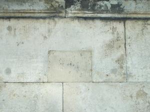 The plaque has long since been taken down, however, you can see the holes in the wall where the plaque used to be.