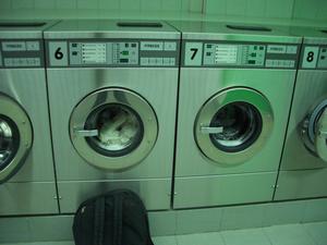 Once inside, you choose a washing machine that is not in use.  Notice the large numbers on each machine.  Also, notice there is no place to put your money.