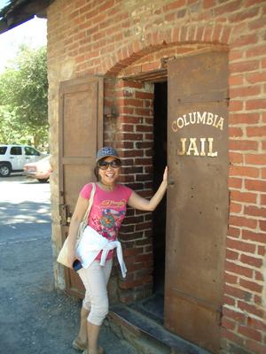 Maggie is posing by the local jail.