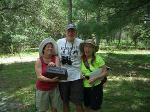 How exciting!  The first geocache of the day!  Helen, my brother Wayne and his girlfriend Rosie with the geocache.