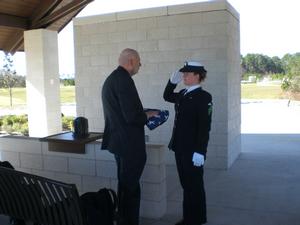 Wayne receiving the flag