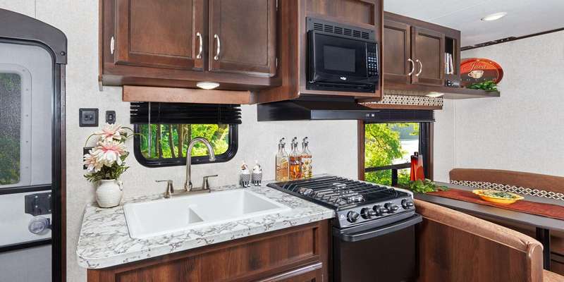 Helen also wanted a 3 burner stove with an oven and I wanted a deep double sink for doing the dishes.
