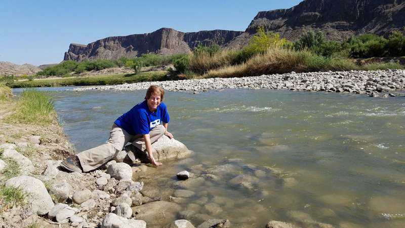 Helen, checking out the temperature of the Rio Grande river.  It was cool.