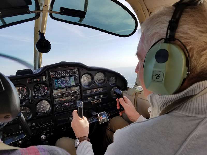 Enjoying a chance to fly the plane.