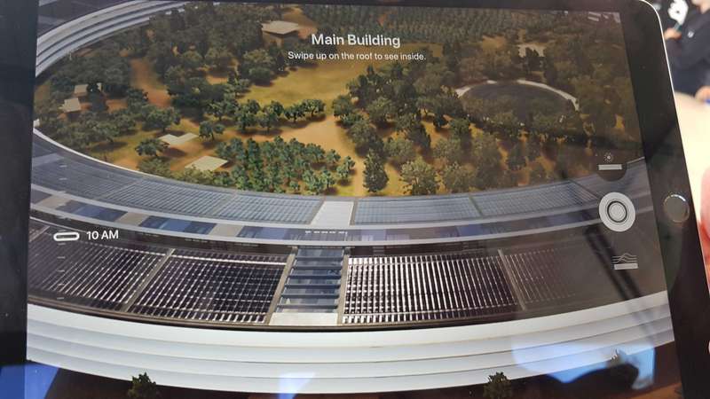 Once we were inside, we were given some Apple iPads.  When they were pointed at the model, the model came alive with lots of detail of the outside of the new "spaceship" building.