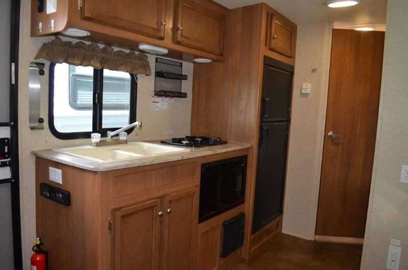 The kitchen had a two burner stove with the microwave oven underneath.  Using this setup confirmed we wanted a three burner stove with a baking oven underneath.