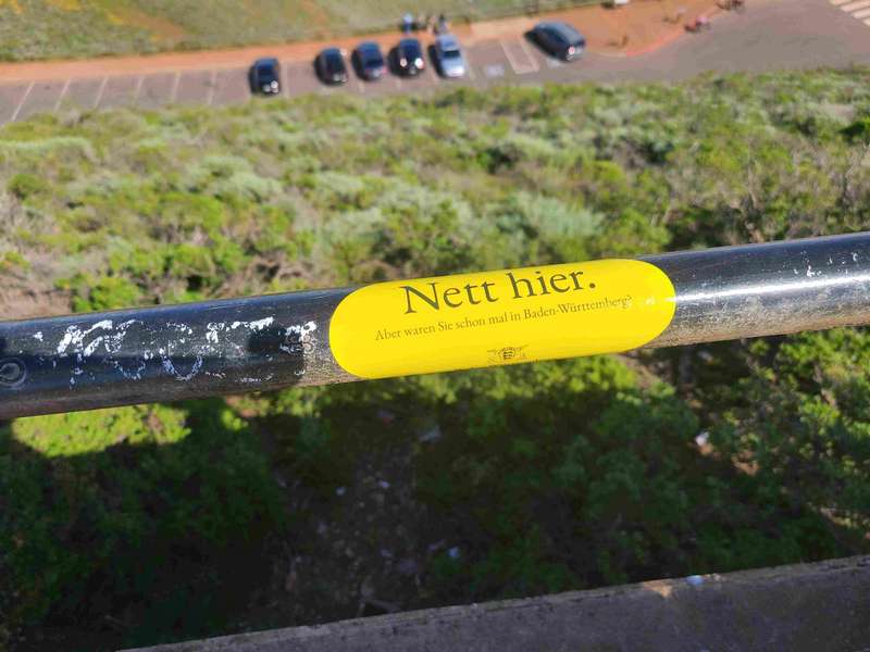 The Girls were surprised to find this sticker on Hawk Hill.  It says: <br><br>"Nice here. <br>But have you ever been to Baden-Württemberg?". <br><br> It is a gorilla marketing campaign by the city of Baden-Württemberg and these stickers are all over Europe.