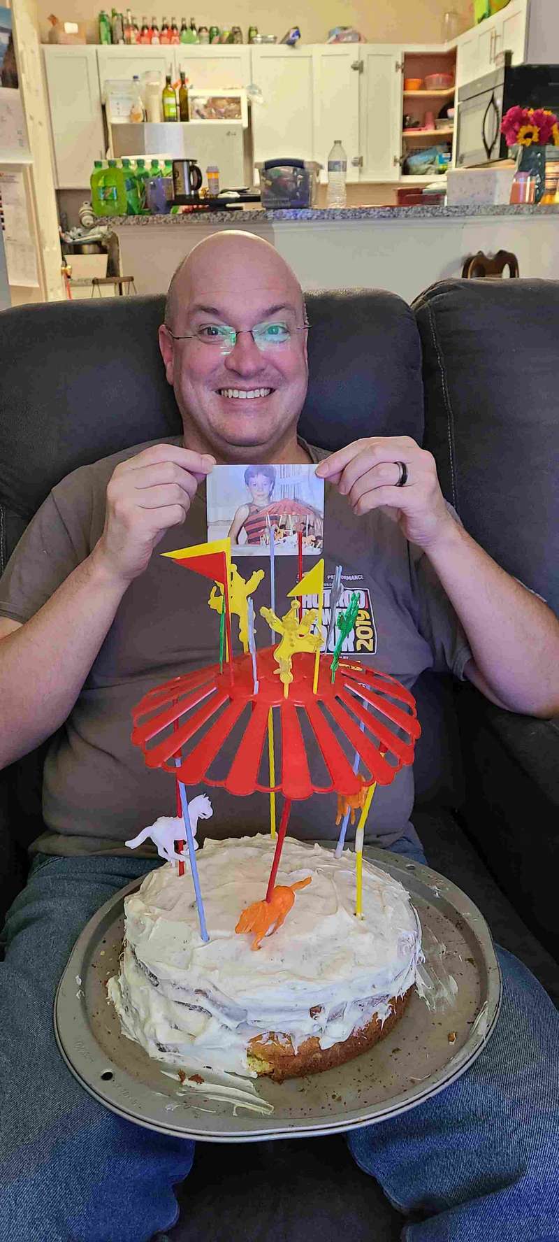 Dave is holding up a picture with him and his cake as a child.  Can you believe Helen kept this all these years.