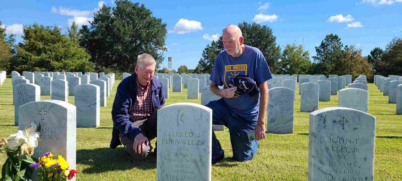Here we are paying respects to our Mom, whose gravestone is on the back.