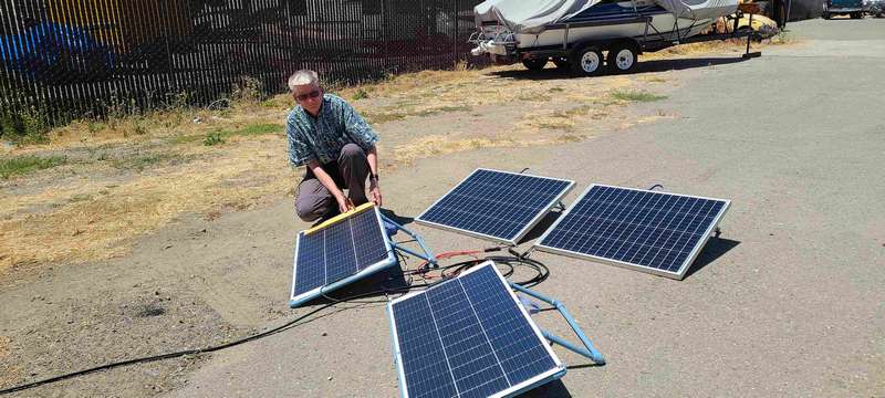 Charging the lithium battery in the trailer.  These are 100 watt solar panels.  I built a stand which can be adjusted to optimize the angle with the sun.