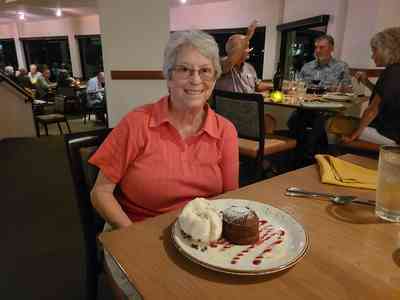 Indulging in a warm chocolate lava cake with a generous scoop of vanilla ice cream.