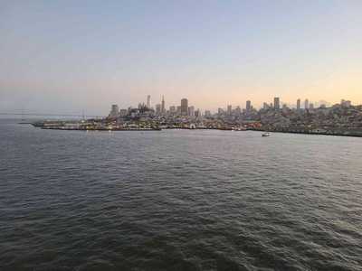 Watching the San Francisco skyline fade into the distance from high above the bridge wing.