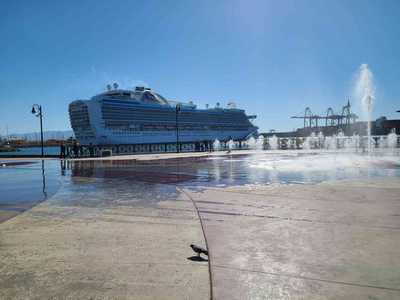 Sprinting through the wind-whipped fountain spray on the Ensenada waterfront.