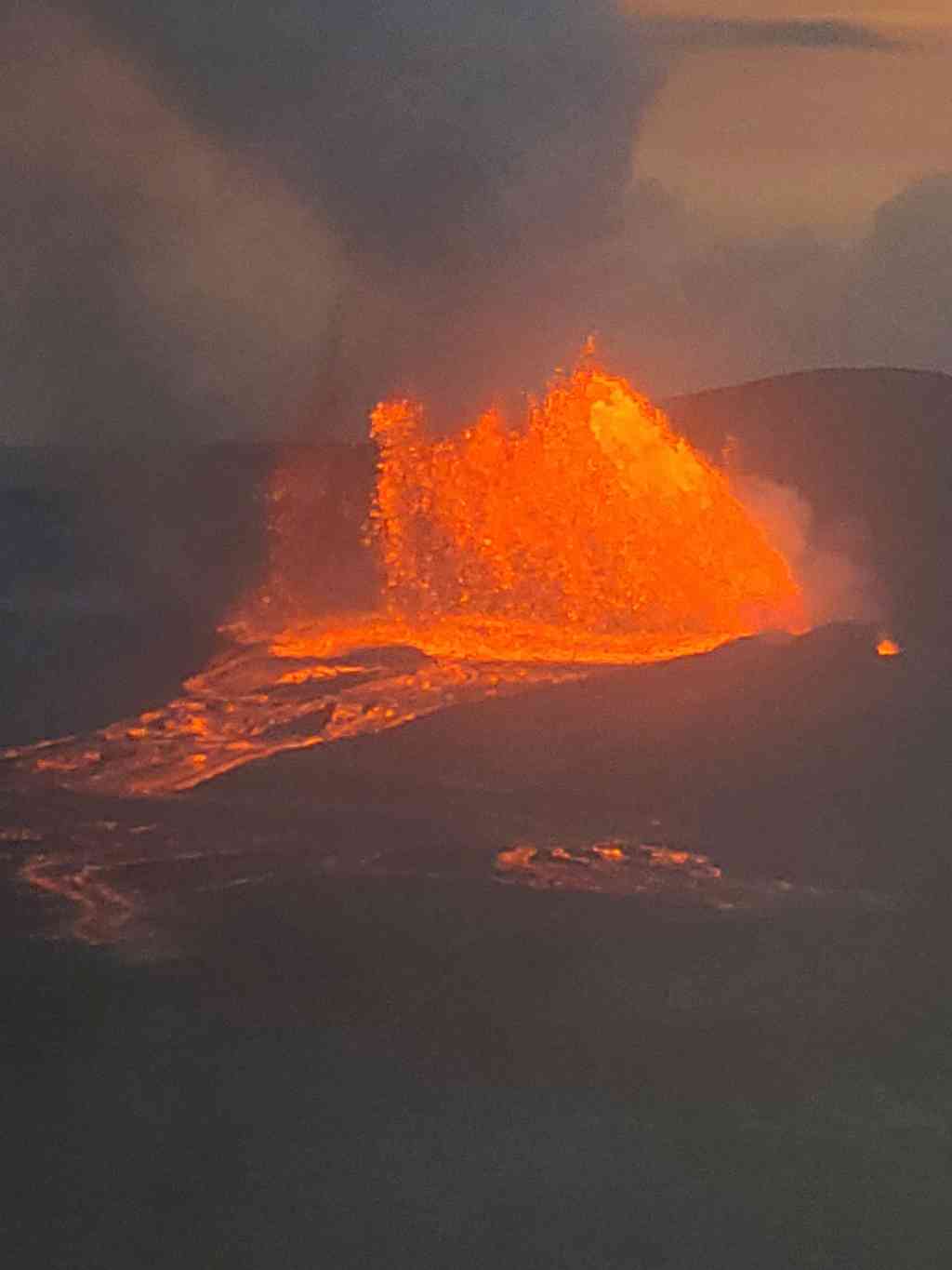 Kilauea glowing at dusk.